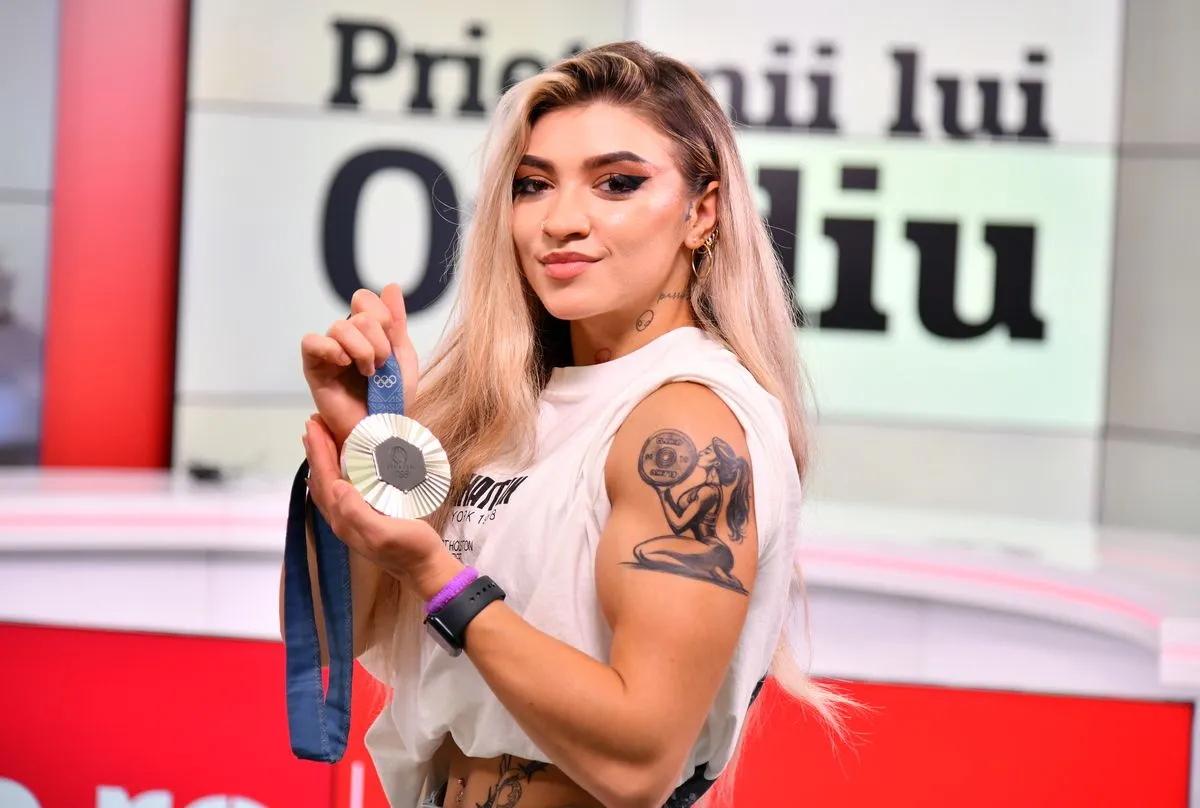 Тяжелоатлетка Михаэла Камбей